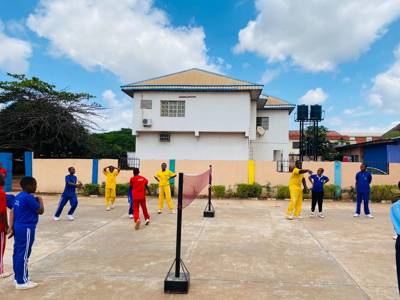 Vonschools students enjoying badminton in the school courtyard