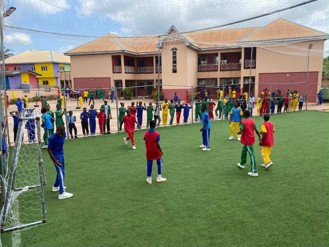 Vonschools students playing football on the school sports field